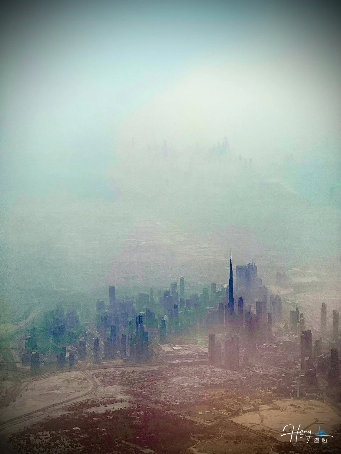 Cityscape-covered-in-morning-mist-from-above