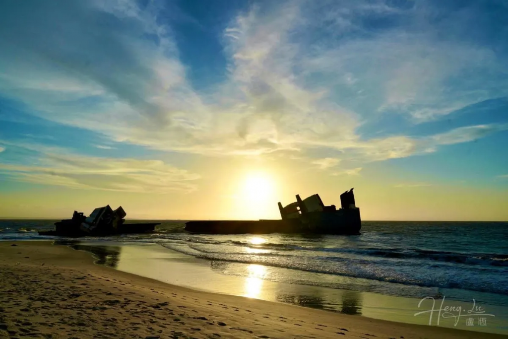 Rusty-shipwreck-on-beach-during-sunset-in-Africa