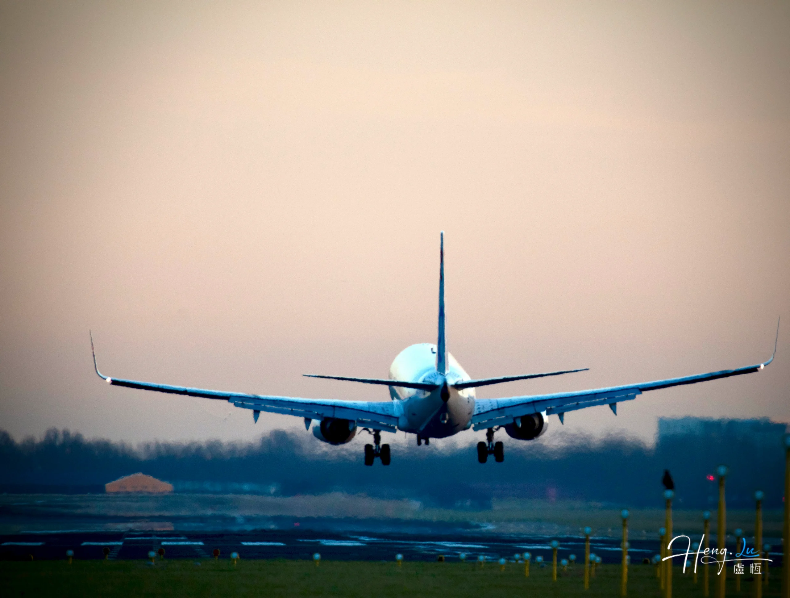 airplane-taking-off-at-dawn