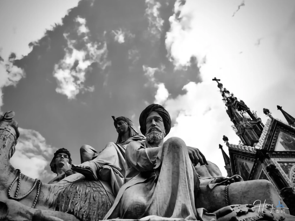 black-and-white-sculpture-against-dramatic-sky