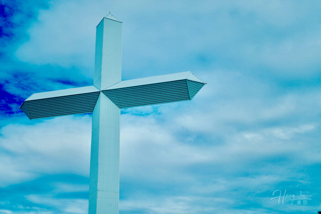 A-large-modern-cross-against-a-blue-sky