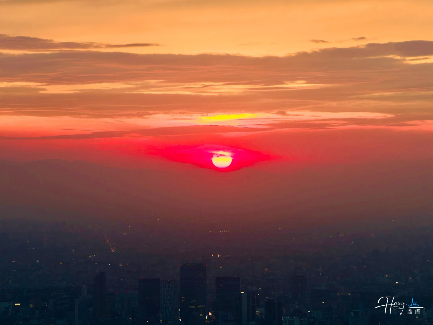 red-sunset-over-city-skyline-with-glowing-clouds