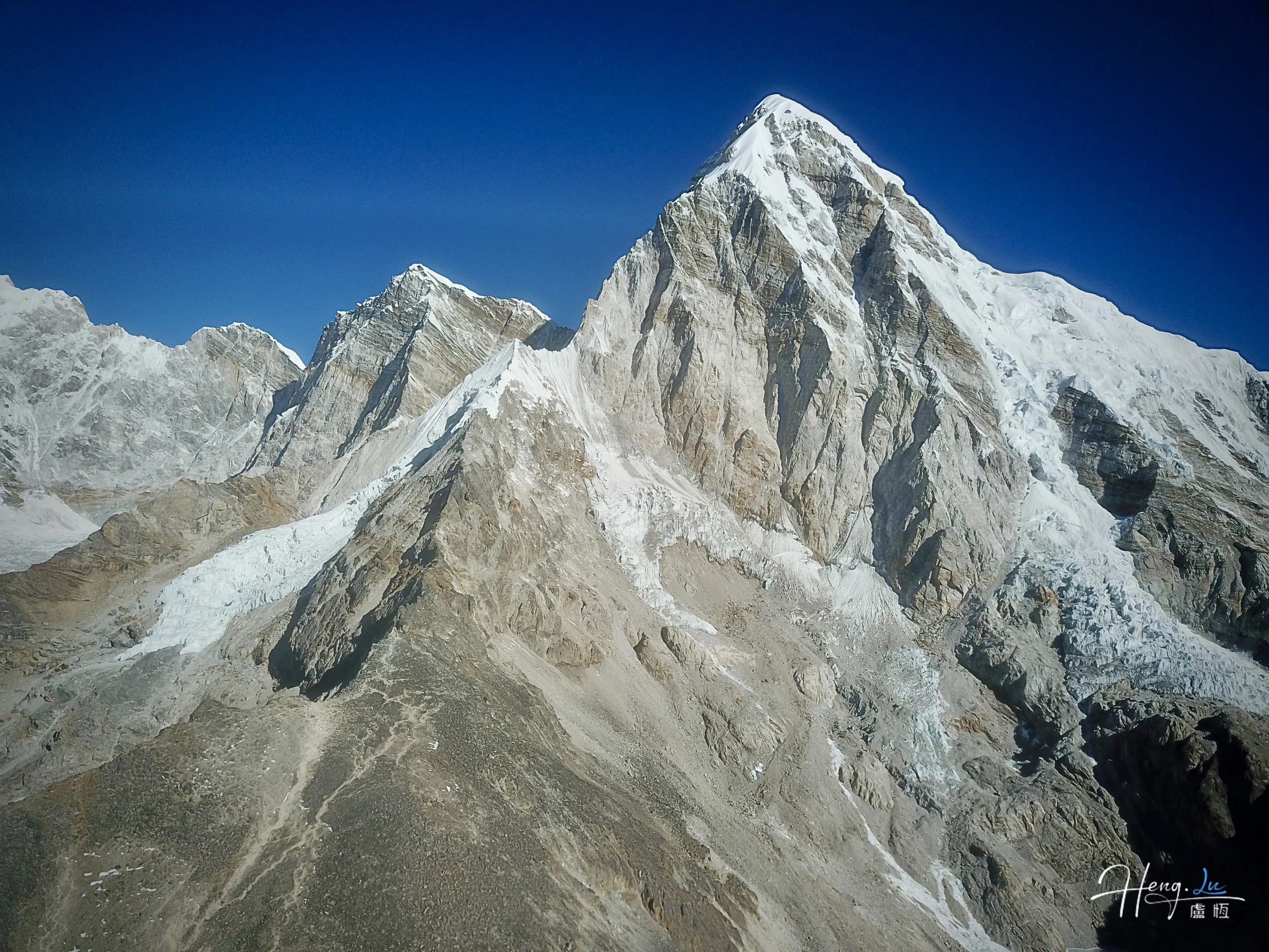 snow-covered-mountain-peaks-under-clear-blue-sky