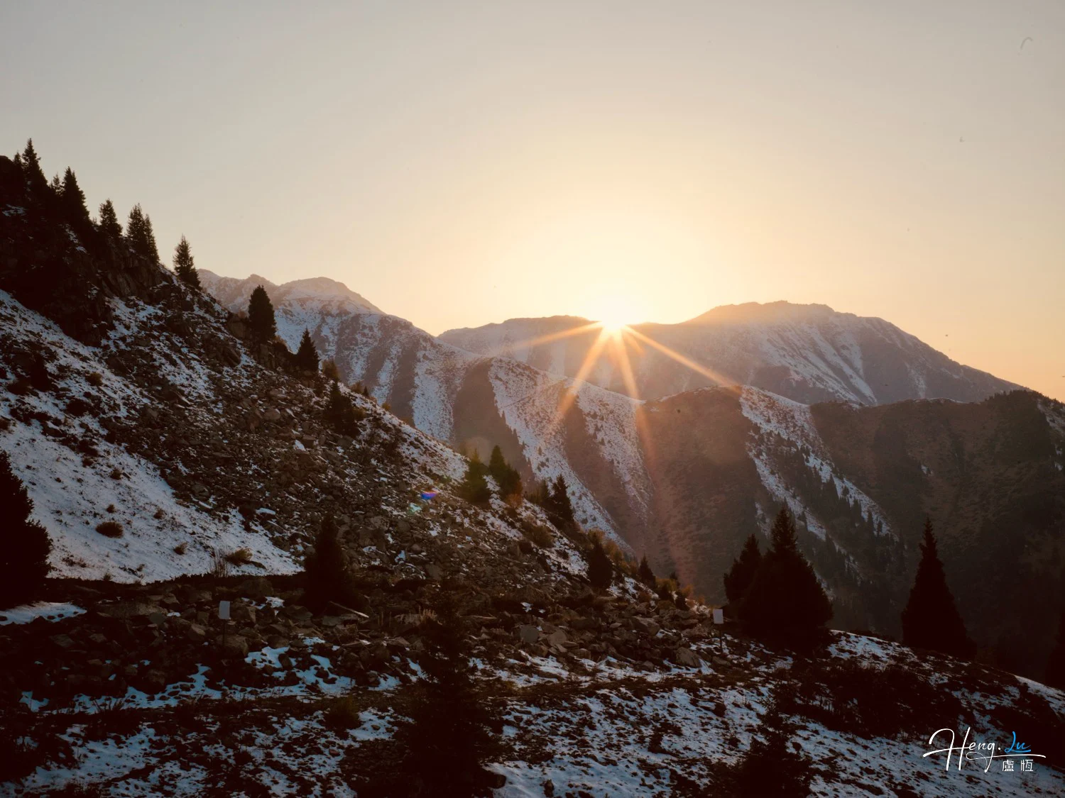 Sunrise-over-snowy-mountain-slopes-with-pine-trees