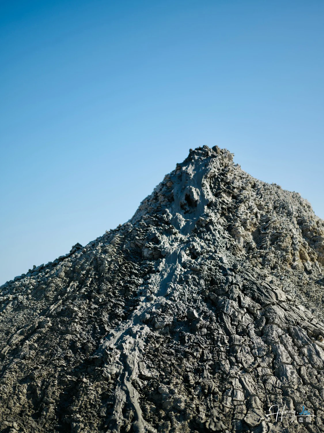 Textured-mountain-peak-under-clear-sky