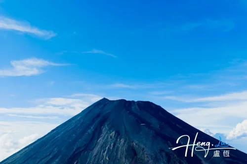 volcanic-peak-under-blue-sky