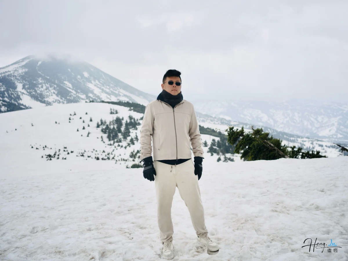 Luheng-standing-on-snowy-mountain-landscape