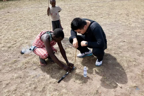 Luheng-learning-fire-making-with-local-guide-in-open-field