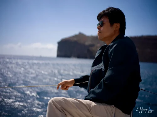 Luheng-sitting-on-boat-facing-horizon