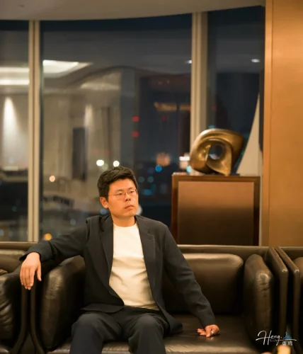 Luheng-sitting-on-sofa-in-modern-lounge