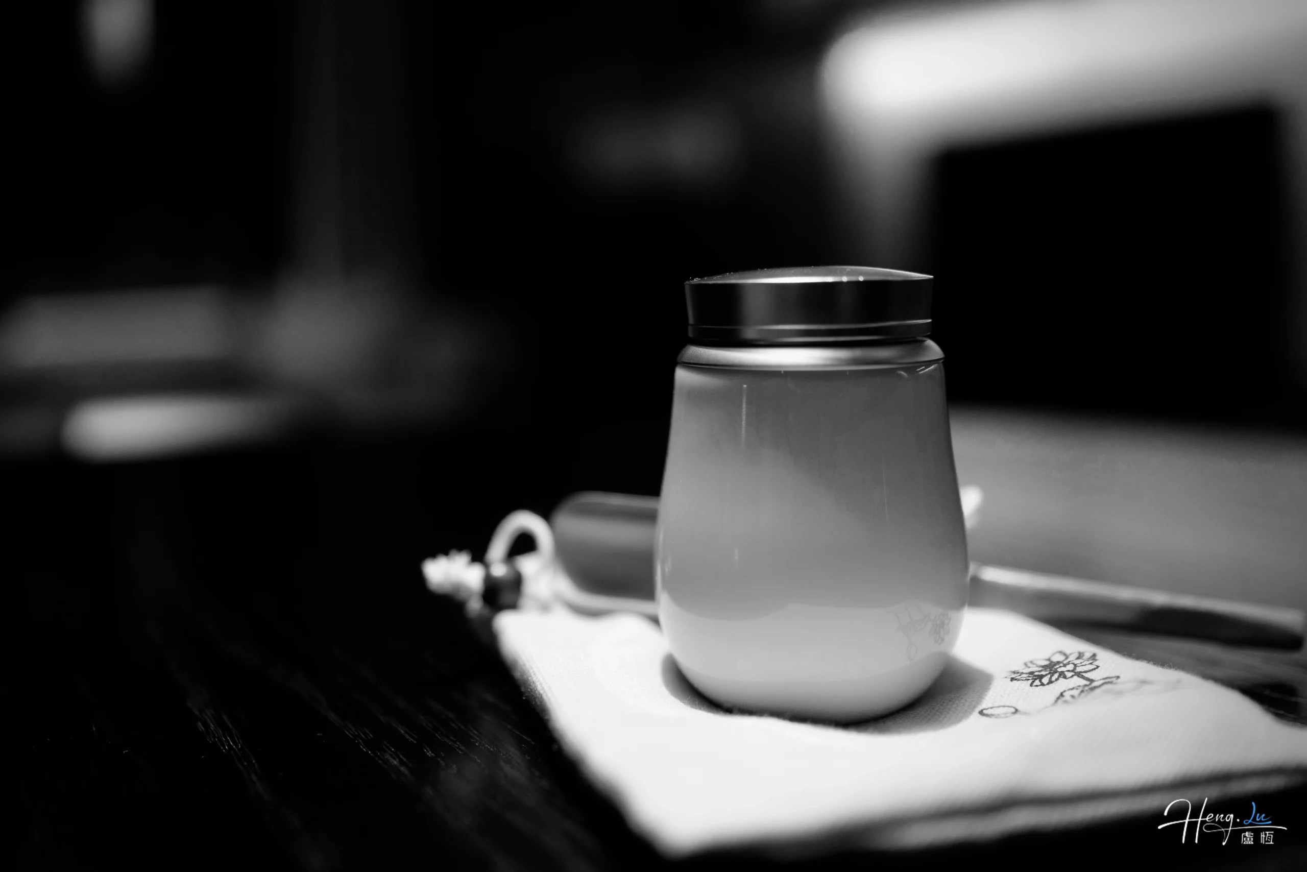 Black and white ceramic cup on a table